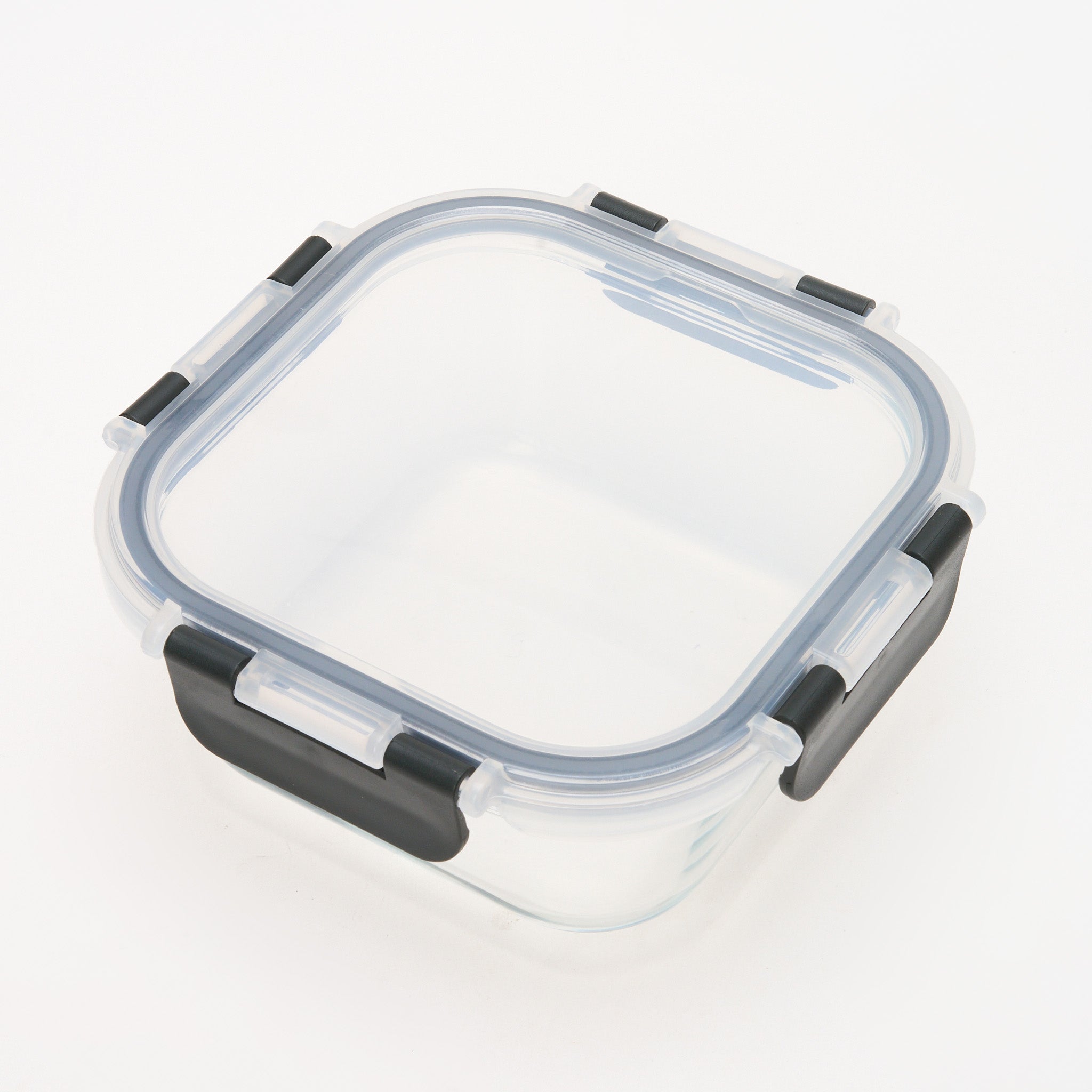 Empty square Storinity glass storage container with locking lid, viewed from above at an angle