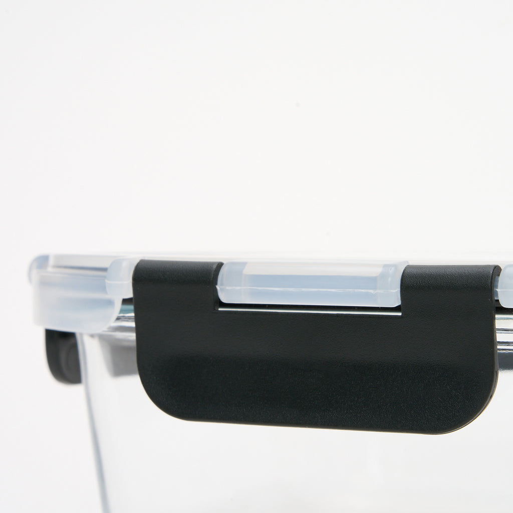 Close-up of the black locking clip mechanism on a Storinity glass storage container lid