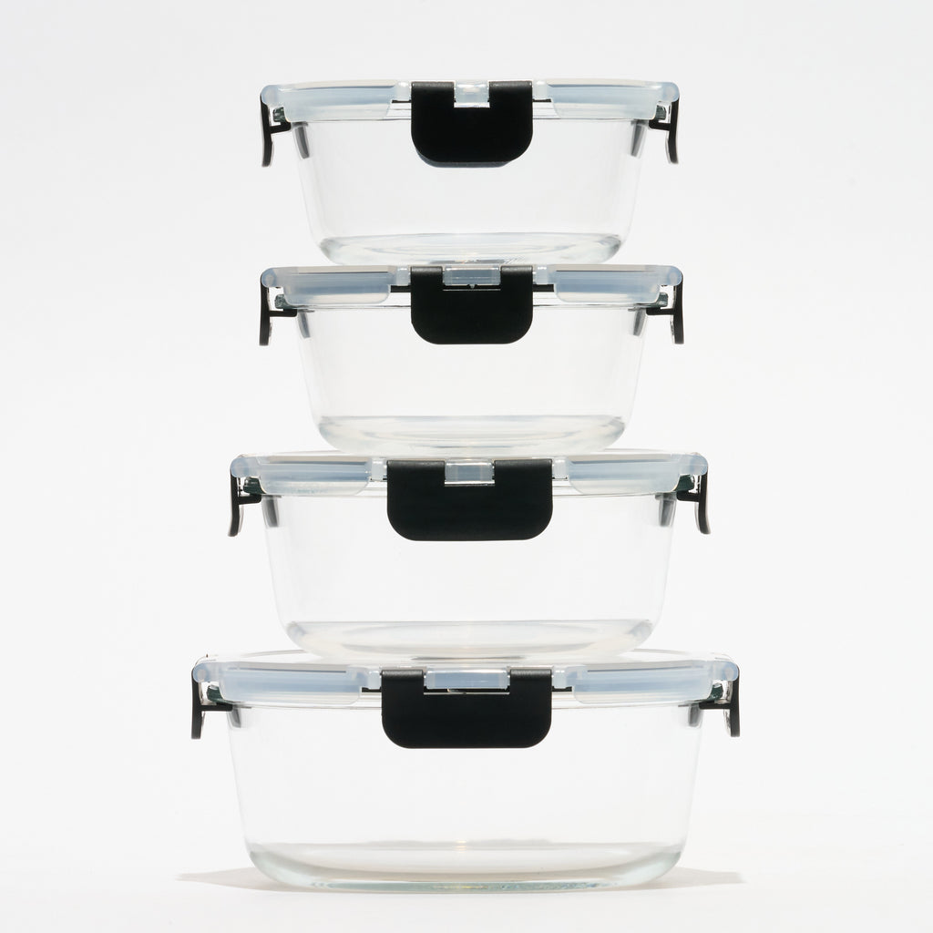 Stack of four empty round Storinity glass storage containers