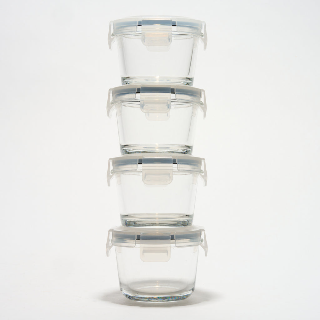 Stack of four empty small round Storinity glass storage containers