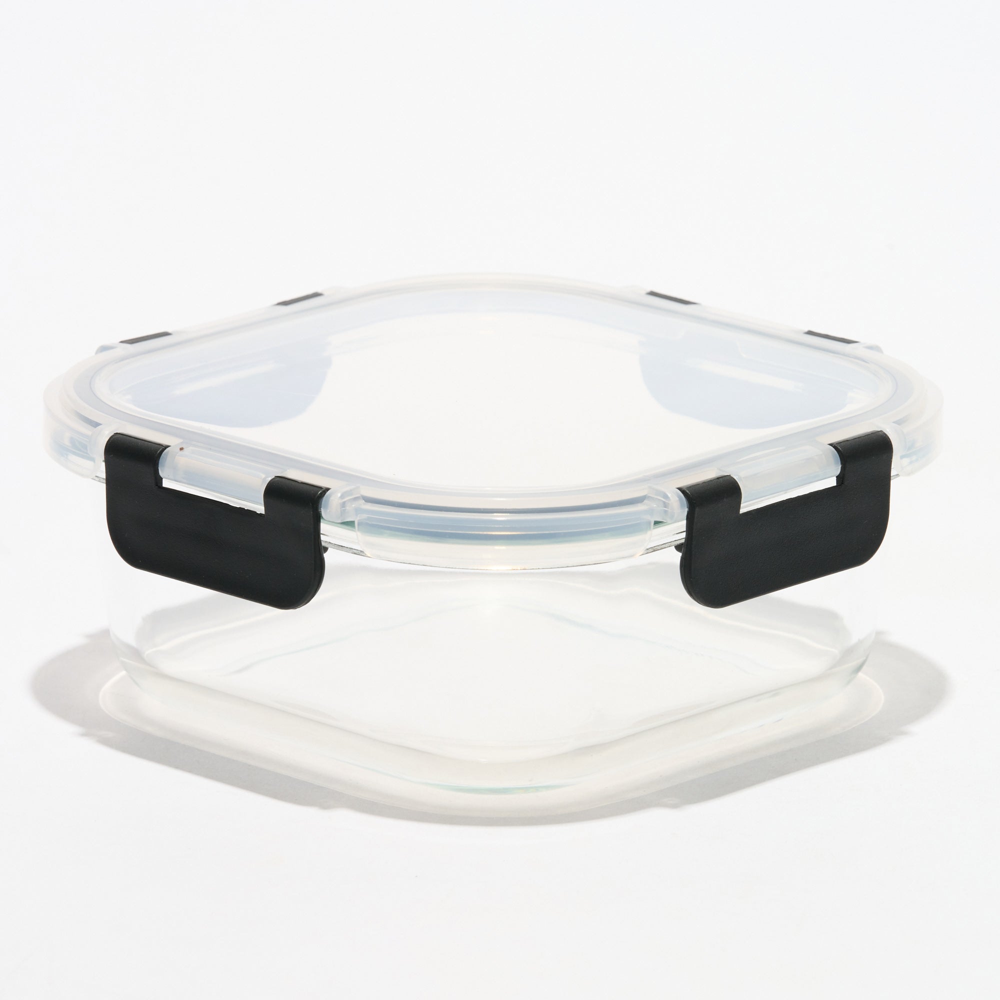 Empty square Storinity glass storage container with locking lid closed, side view