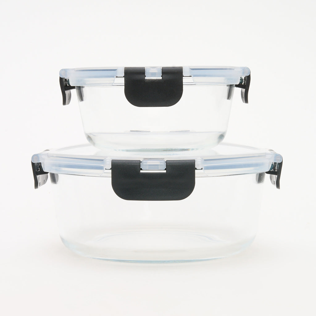 Two empty round Storinity glass storage containers stacked