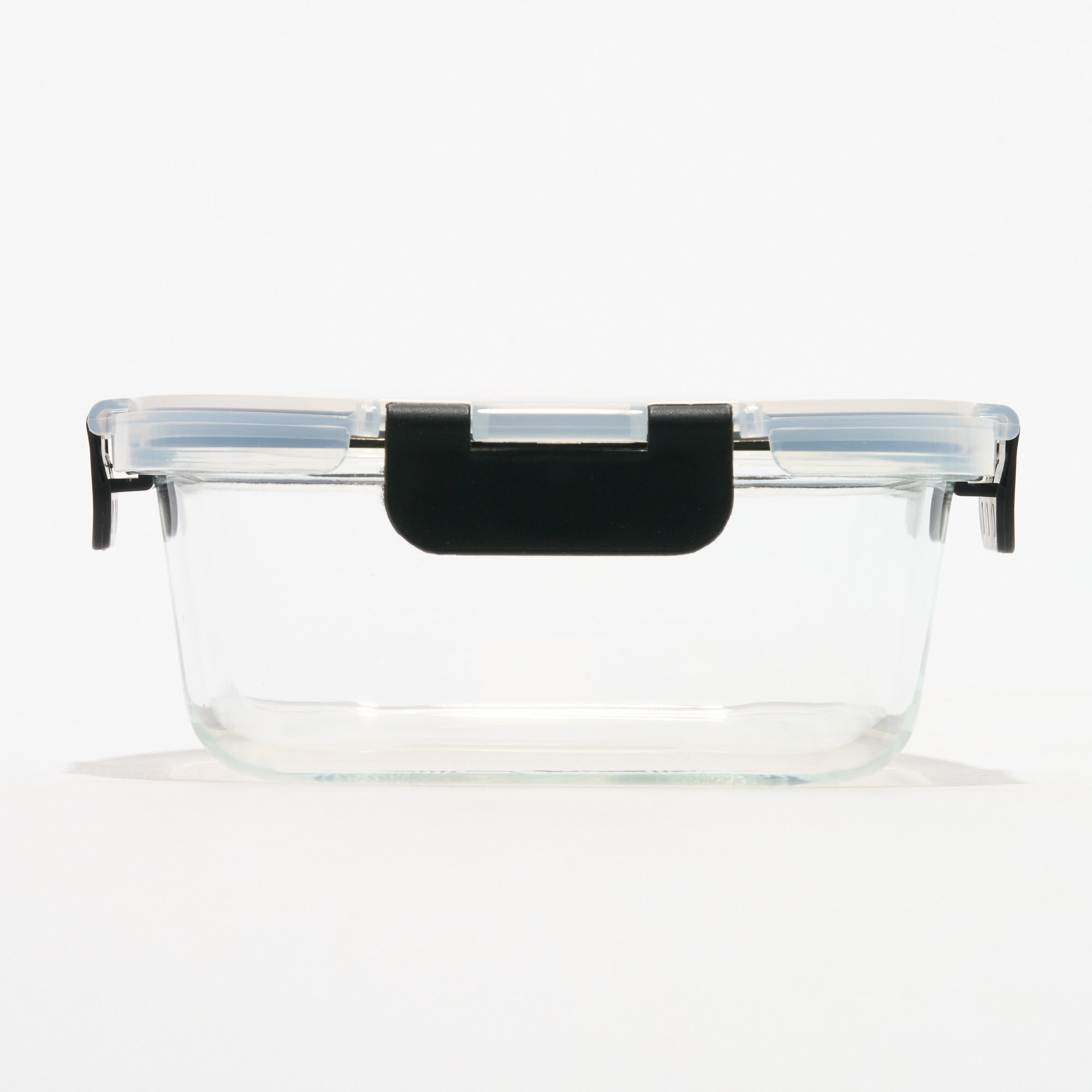 Empty rectangular Storinity glass storage container with locking lid closed, front view