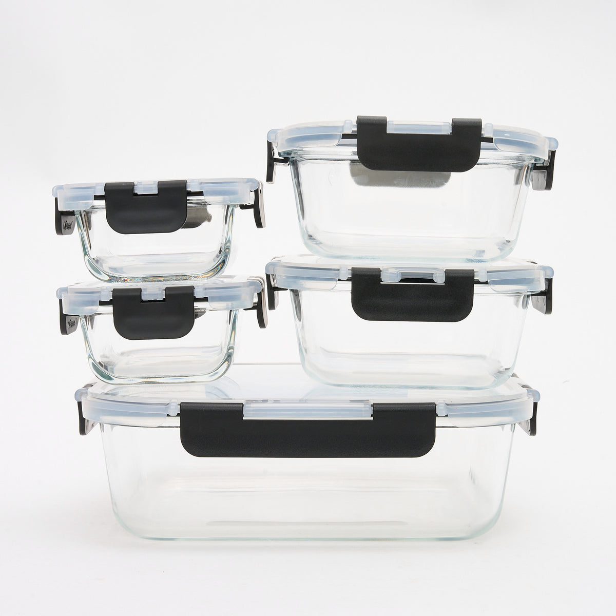 The full Storinity 10-Piece Glass Container set stacked together, empty, with black locking lids