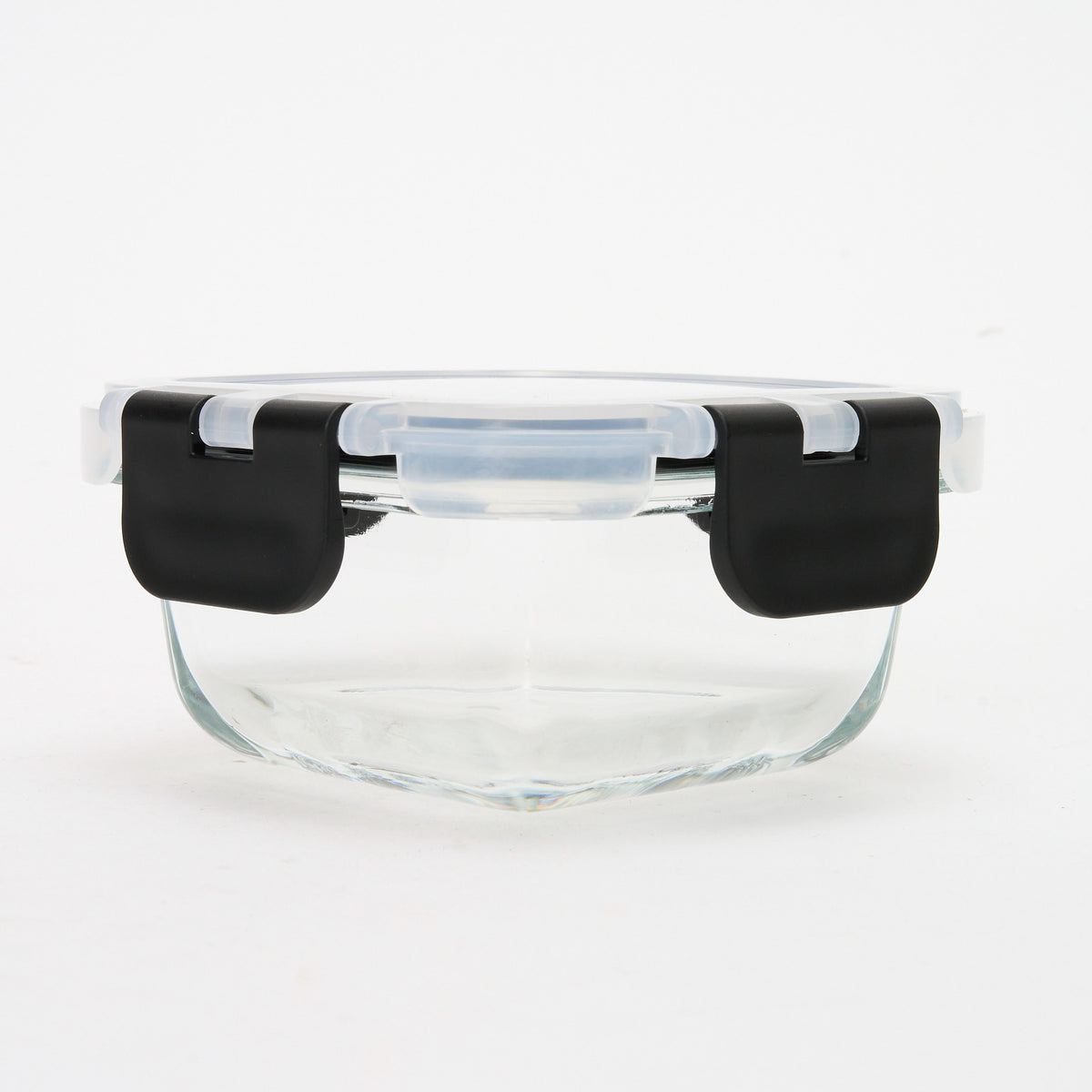 Empty round Storinity glass container with black locking lid closed, front view