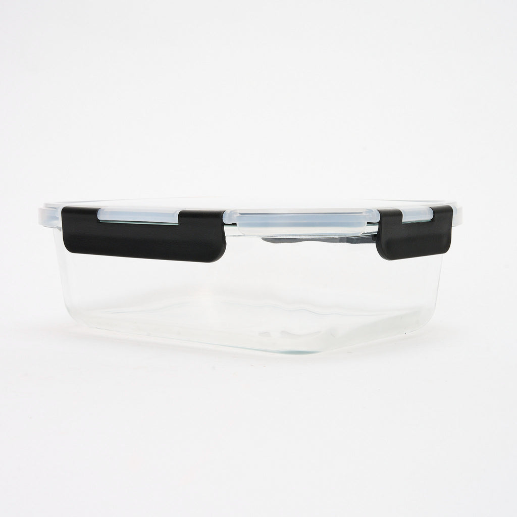 Empty rectangular Storinity glass container with black locking lid closed, front view