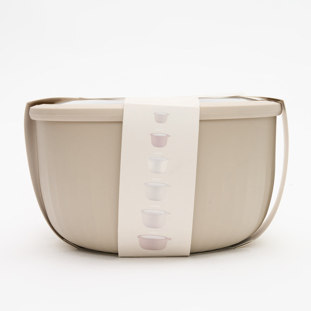 The full Storinity 12-Piece Airtight Nesting Bowl set nested together and wrapped with a size guide label