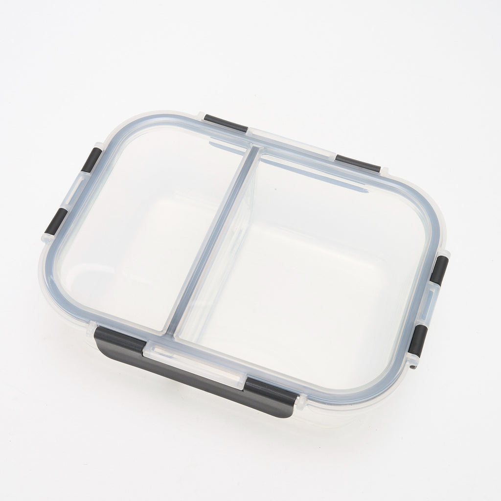 Overhead view of an empty Storinity divided glass container showing the two compartments