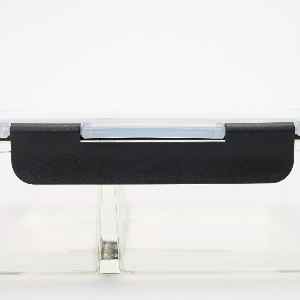Close-up of the black locking clip mechanism on a Storinity divided glass container lid