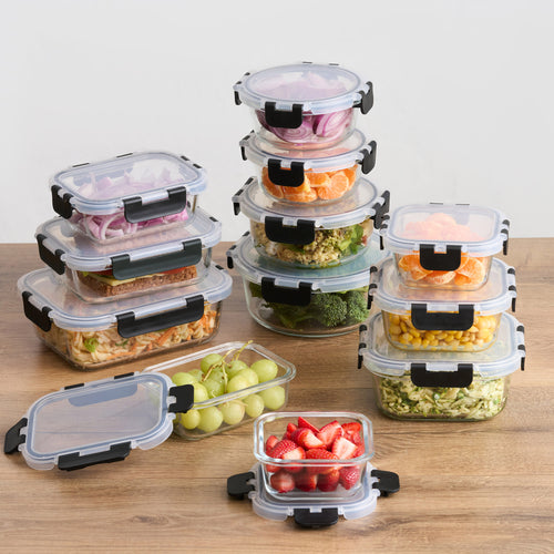 24-piece air tight glass storage container set with food, stacked on wooden table