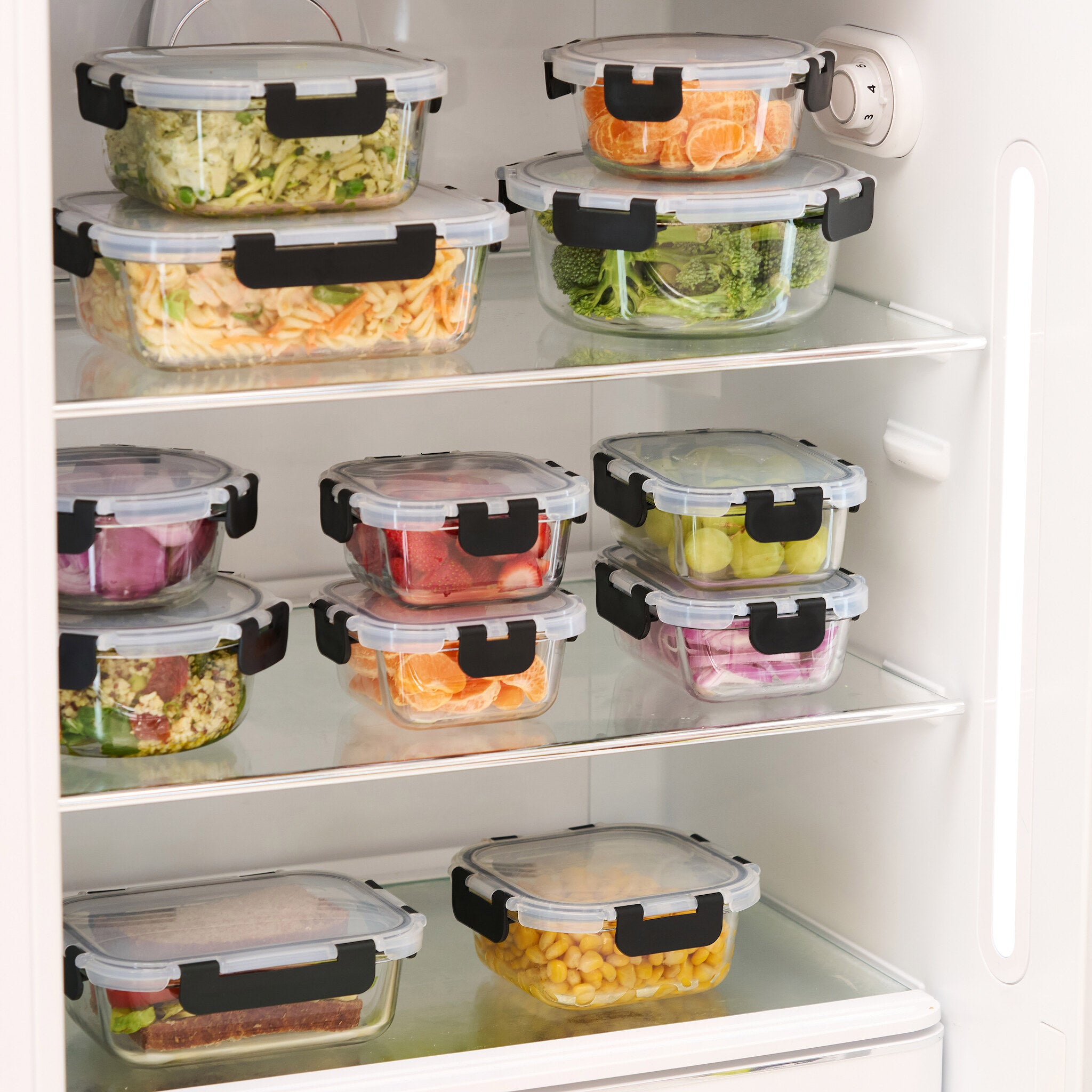 Full fridge organised with stackable glass storage containers