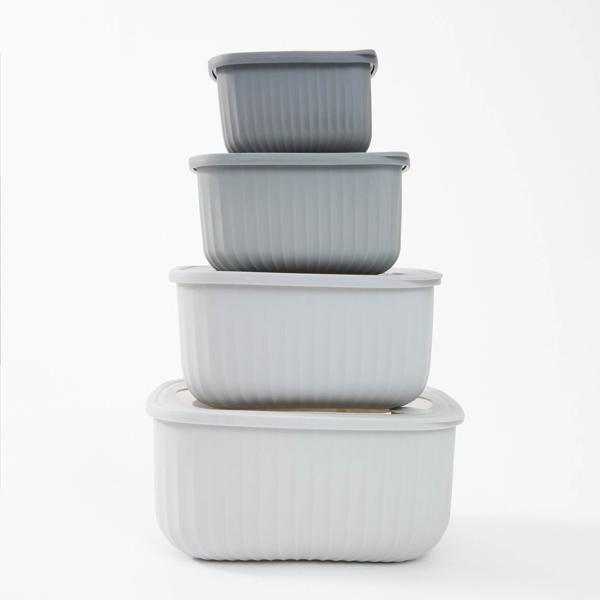 The four grey Storinity rectangular nesting bowls stacked inside each other with their lids on